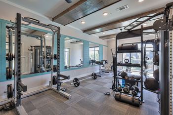 24-Hr fitness center with peloton, free weights, and more
